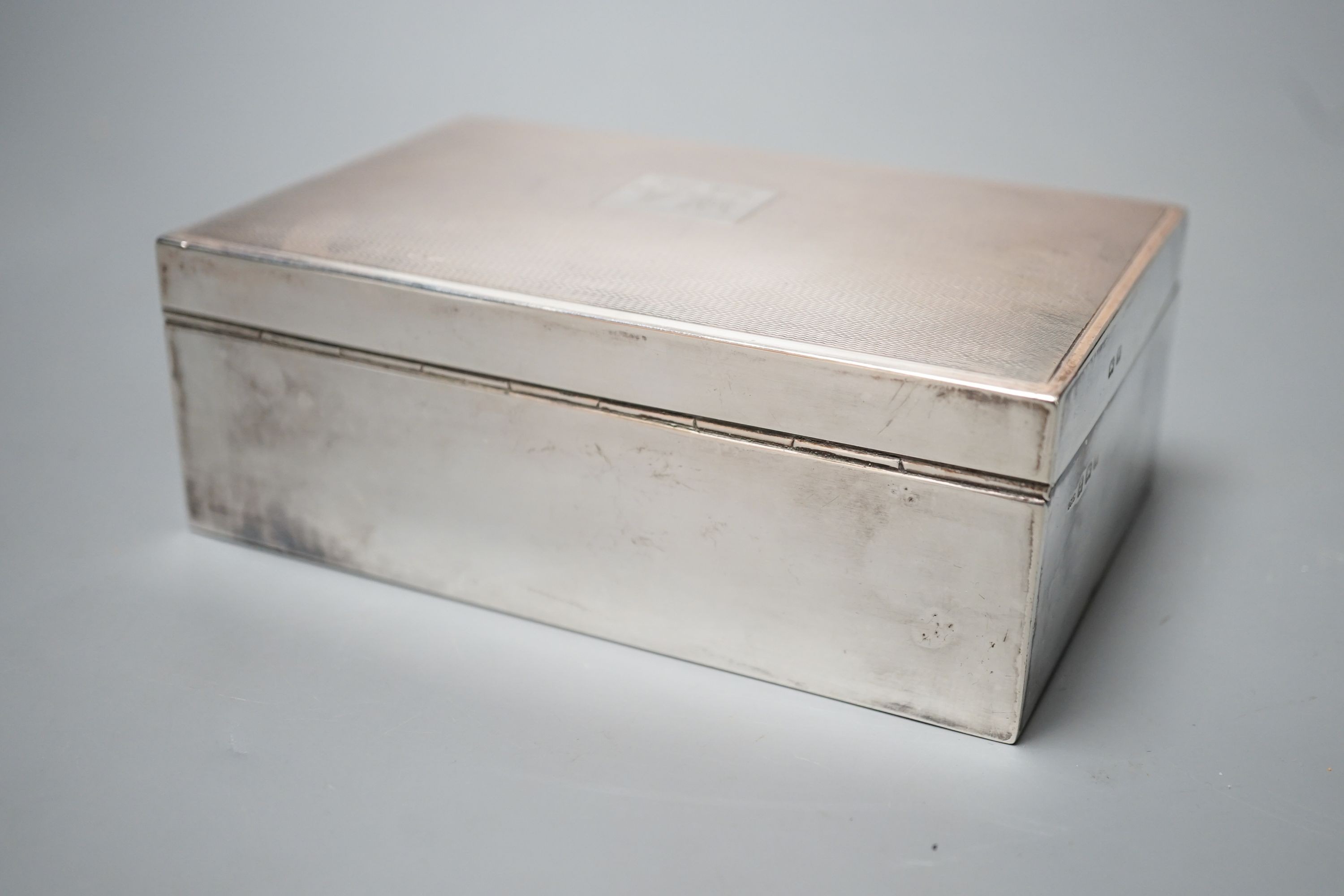 A 1950's part engine turned silver mounted cigarette box, 14.3cm, gross 14.5oz